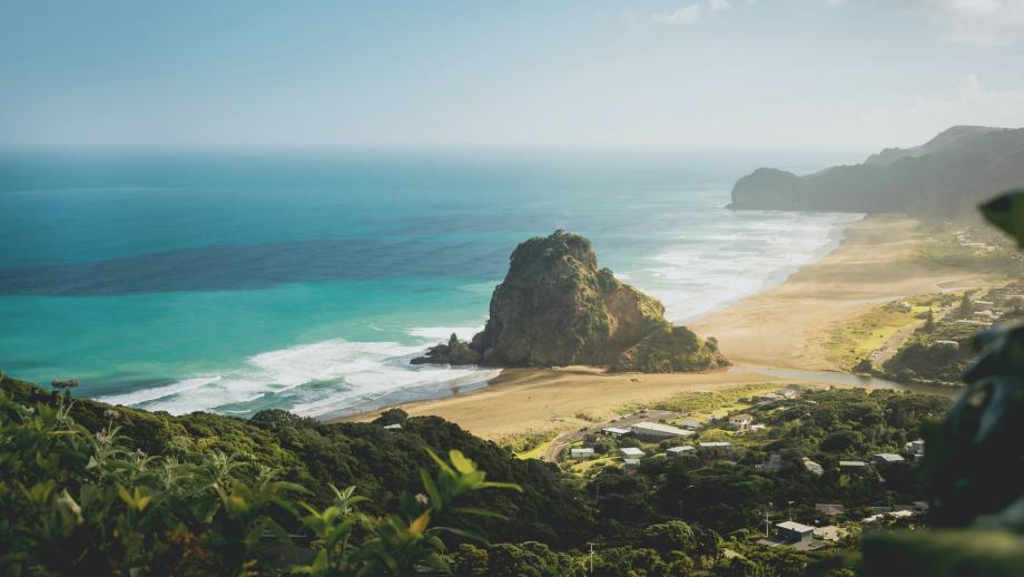 white beach shot from above with stone island in the shore