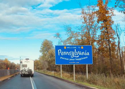 welcome to pa road sign on the highway
